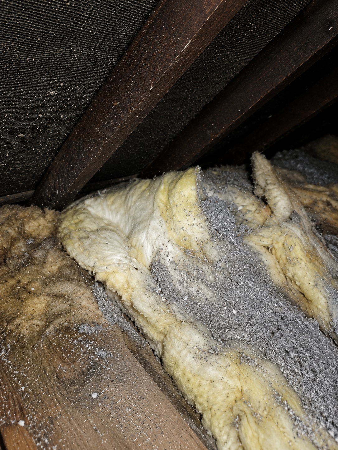 Old contaminated loft insulation and debris requiring safe removal